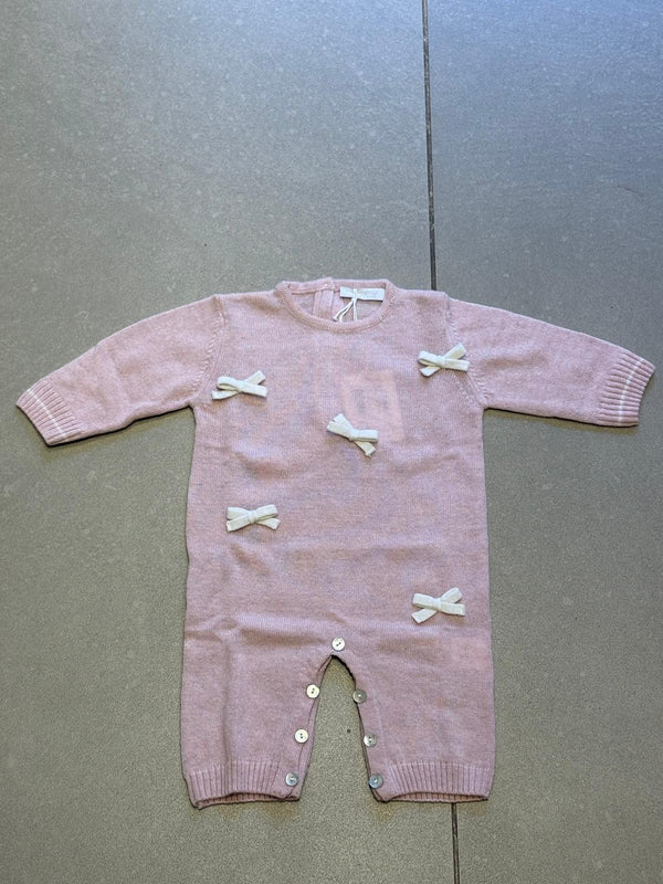 Tutina in lana rosa con fiocchetti panna