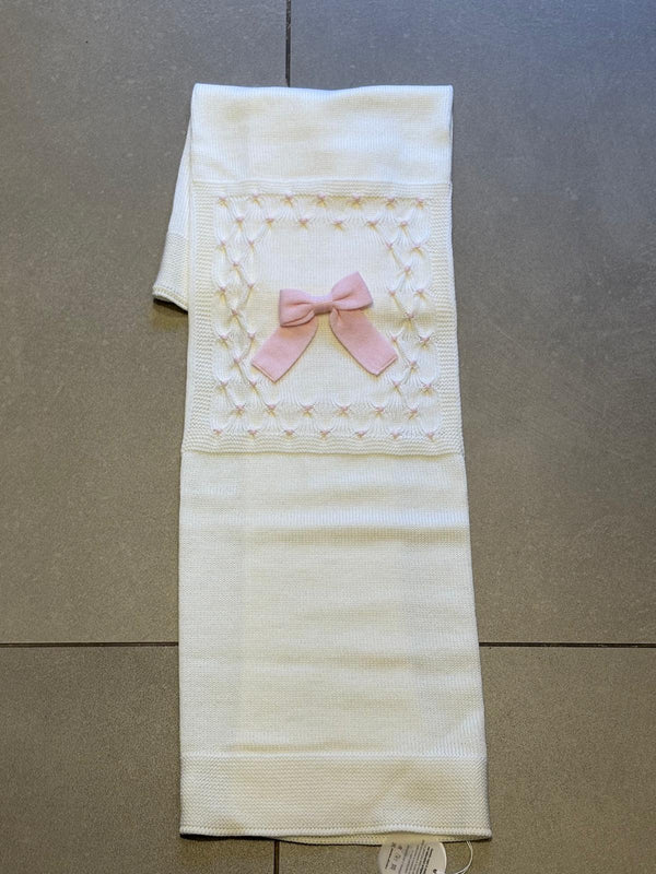 Coperta in lana fondo panna con fiocco rosa