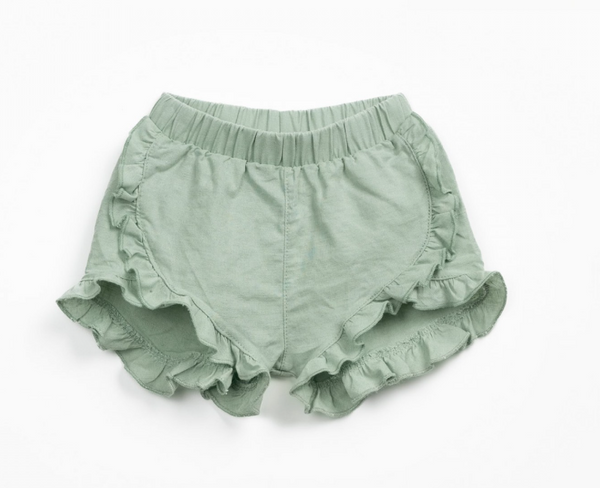 Pantaloncini in lino e cotone con volant laterali verde